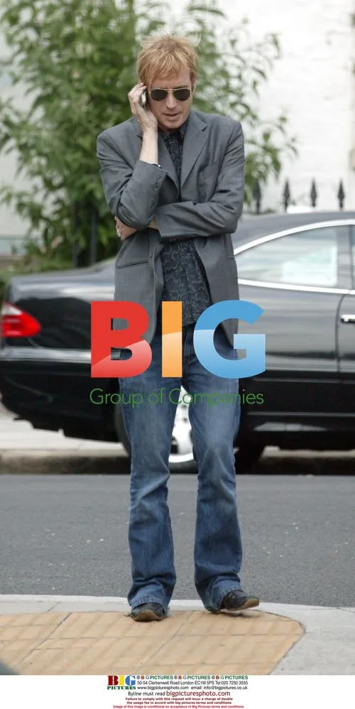 Rhys Ifans on Mobile Phone in London