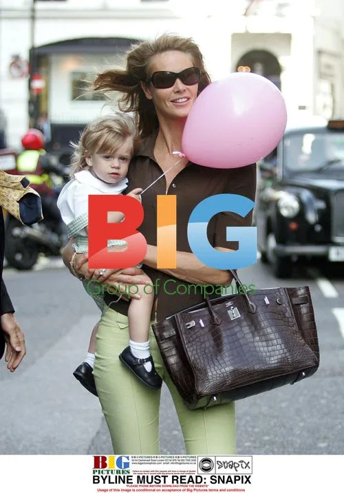 Elle Macpherson with son leaving restaurant