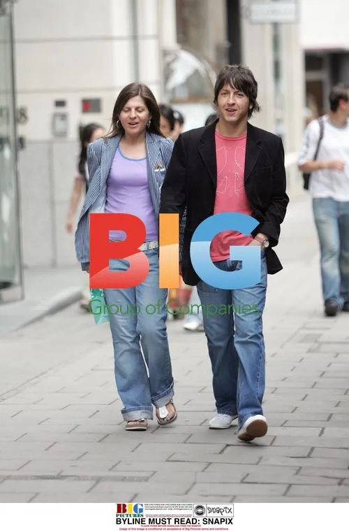 Oasis Guitarist Gem Archer Walking in London