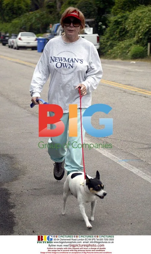 Shirley MacLaine walks dog on Malibu beach