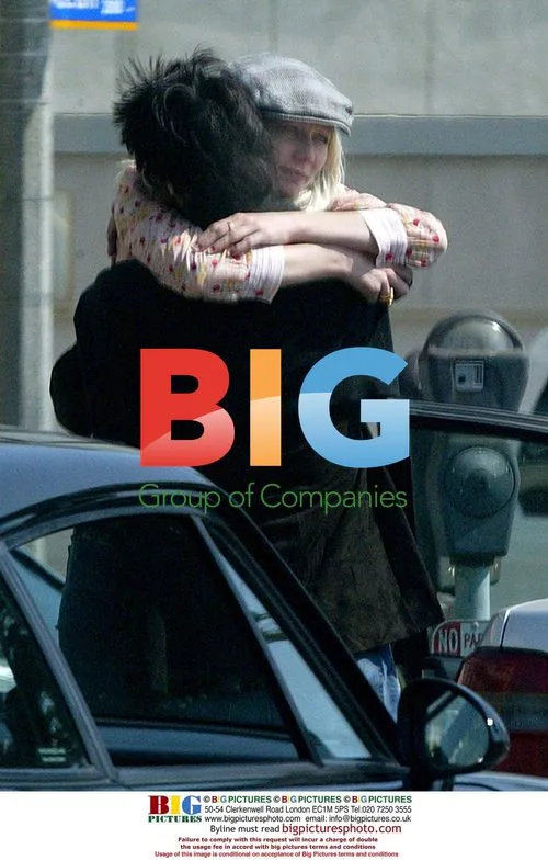 Keanu Reeves and Autumn Macintosh Sharing Hug in Parking Lot