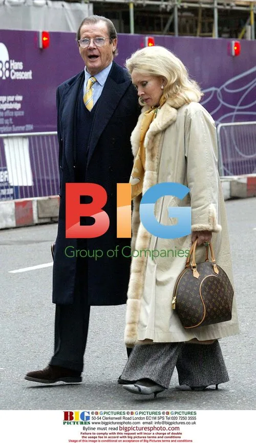 Sir Roger Moore and wife Kristina out in London