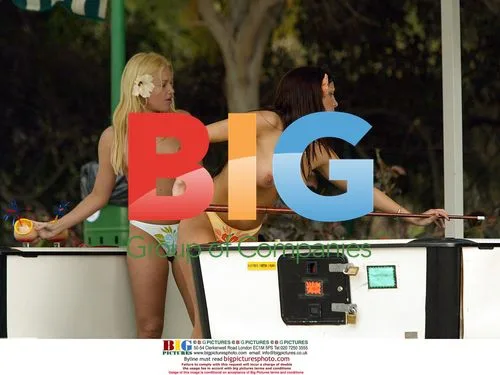 Glamour model Coralie Eichholtz plays pool with friend in Canary Islands