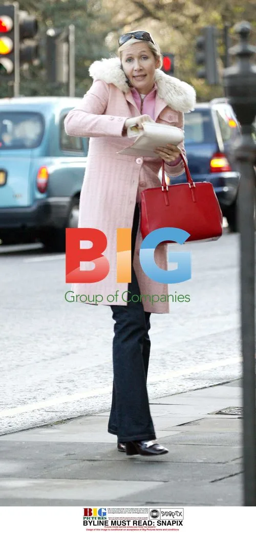 Tania Bryer Talking on Phone in London