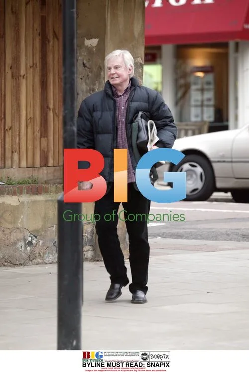 Sir Derek Jacobi walking in London