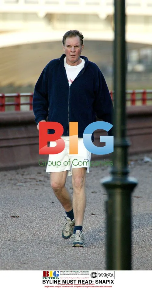 Politician Jonathan Aitken goes for run in London