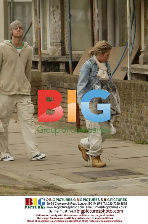 Lucy Benjamin and boyfriend arriving at flat