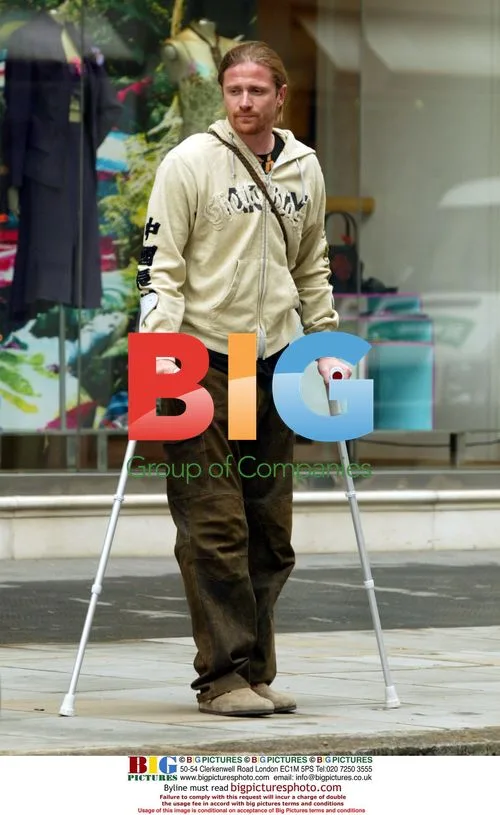 Emmanuelle Petit waits on crutches