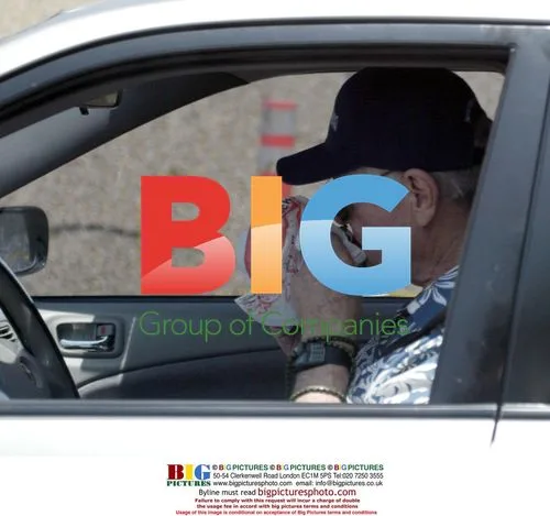 Larry Hagman Eats Burger at Red Light in Malibu