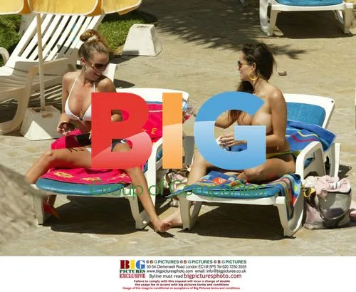 Page 3 models tanning by pool in Tenerife