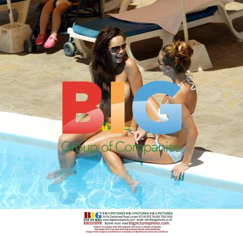 Models Tanning by Pool in Tenerife
