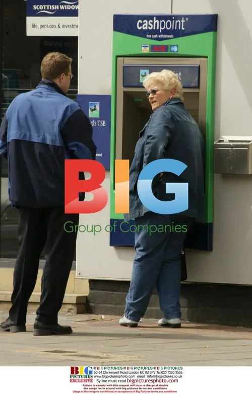 Pam St Clement Struggles with Cash Machine
