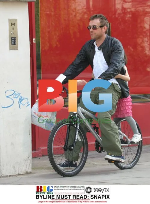 Damon Albarn with Daughter on BMX