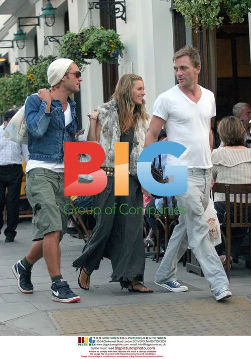 Jude Law and Sienna Miller stroll in London