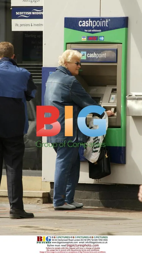 Pam St Clement at Cash Machine