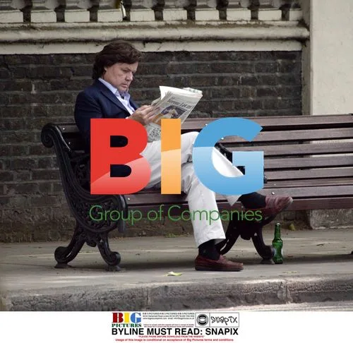 Rupert Allason Reading Newspaper