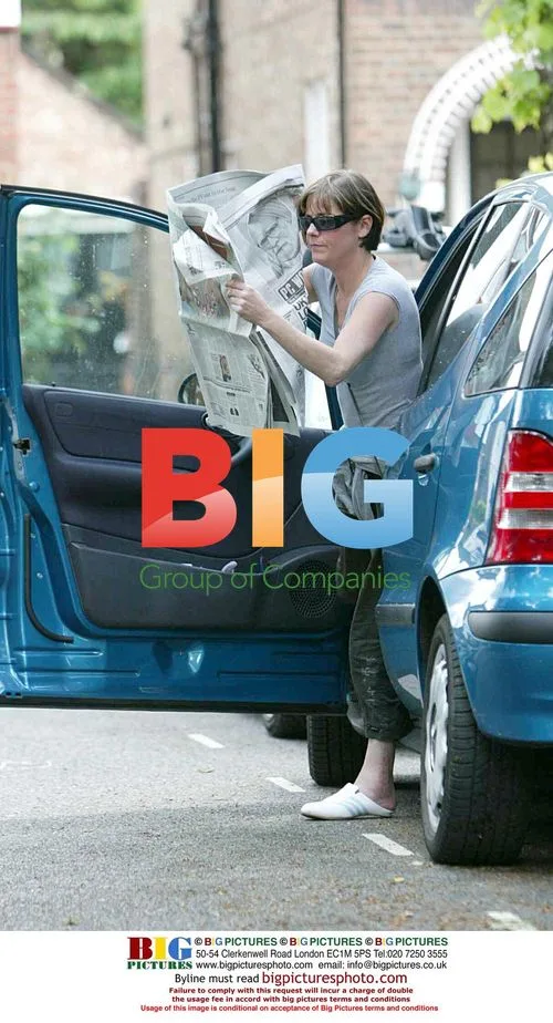 Elaine Lordan Hides Face With Newspaper