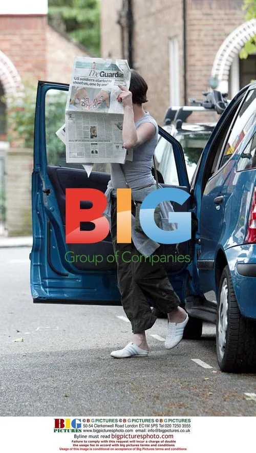 Elaine Lordan hiding face with newspaper