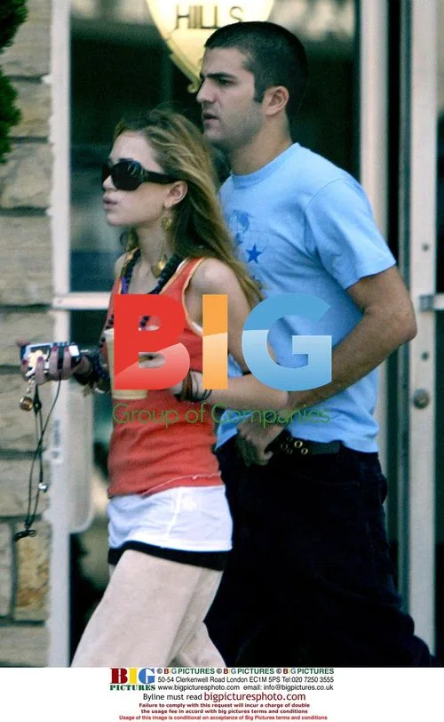 Thin-looking Mary Kate Olsen with boyfriend in Beverly Hills