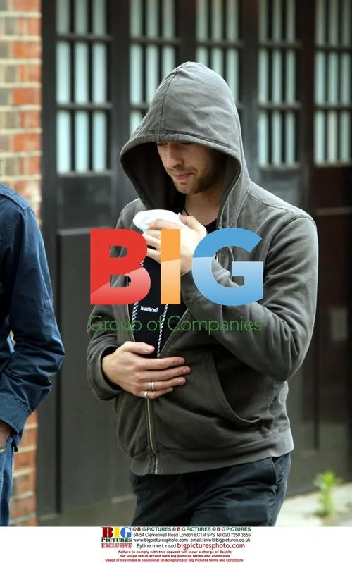 Chris Martin walking with baby Apple