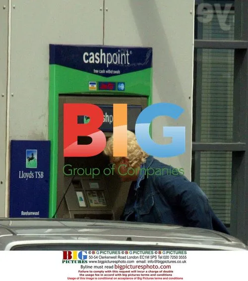 Pam St Clement at Cash Machine