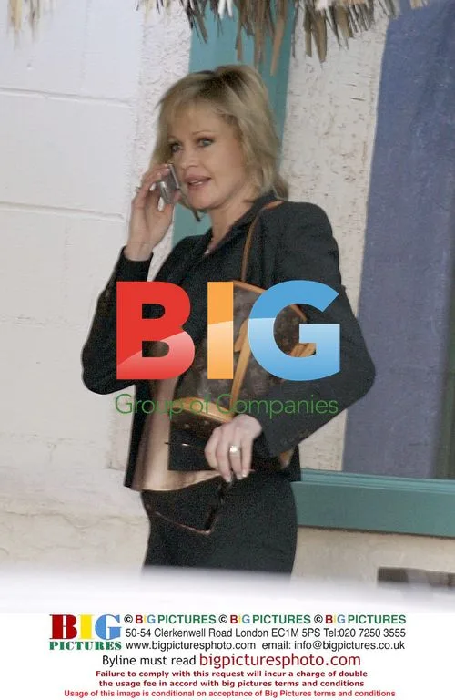 Melanie Griffith Picks Up Daughter From School