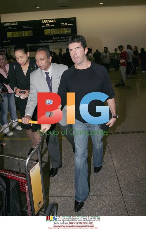 Simon Cowell Arrives at LAX