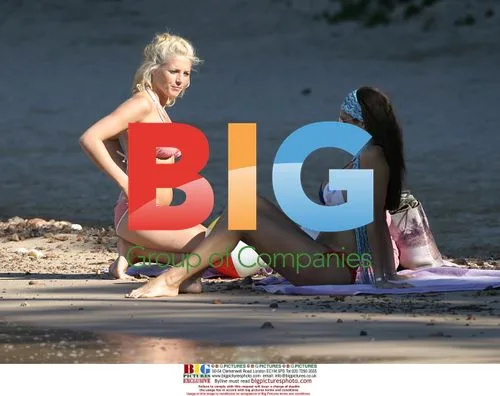 Glamour models Jerri and Jo play on the beach