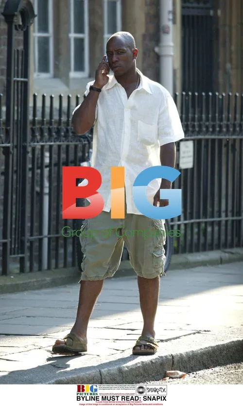 Ian Wright Talking on Phone in London