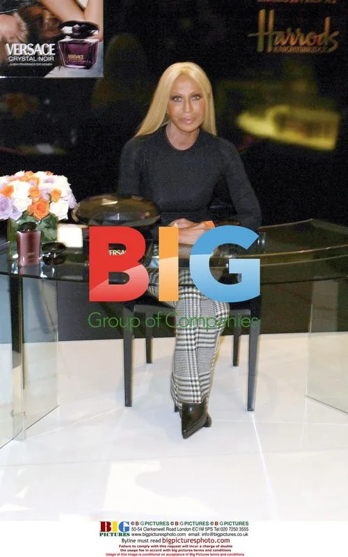 Donatella Versace signing 'Crystal Noir' perfume