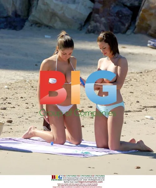Glamour models Lucy and Sophie on beach