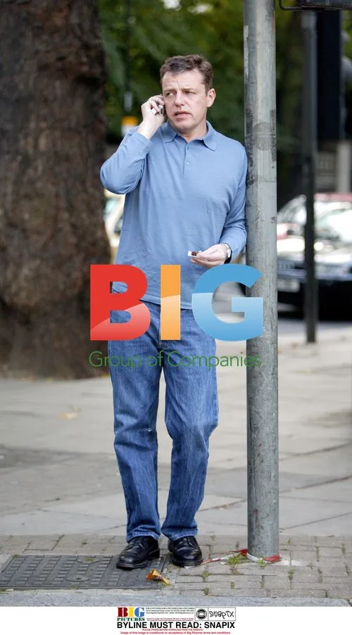 Suggs from Madness Smoking Outside London Bar