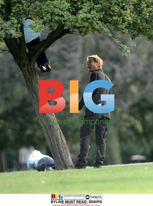Jude Law with children in London park