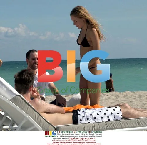 Chloe Sevigny Relaxing on Beach