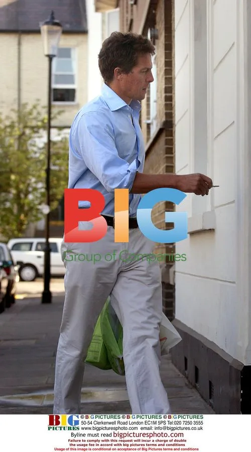 Hugh Grant Returning Home from Shopping
