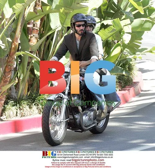 Keanu Reeves rides with girlfriend