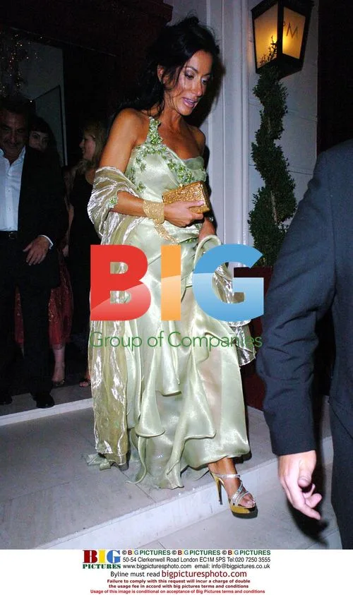 Nancy Dell'Ollio Carrying Birthday Gifts