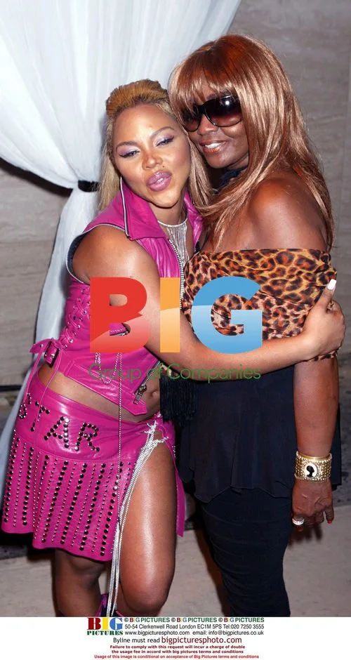 Lil' Kim and Janice Combs at Sean John Store Opening