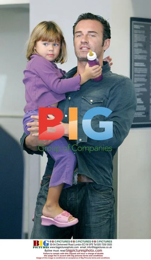 Julian McMahon and daughter at LAX