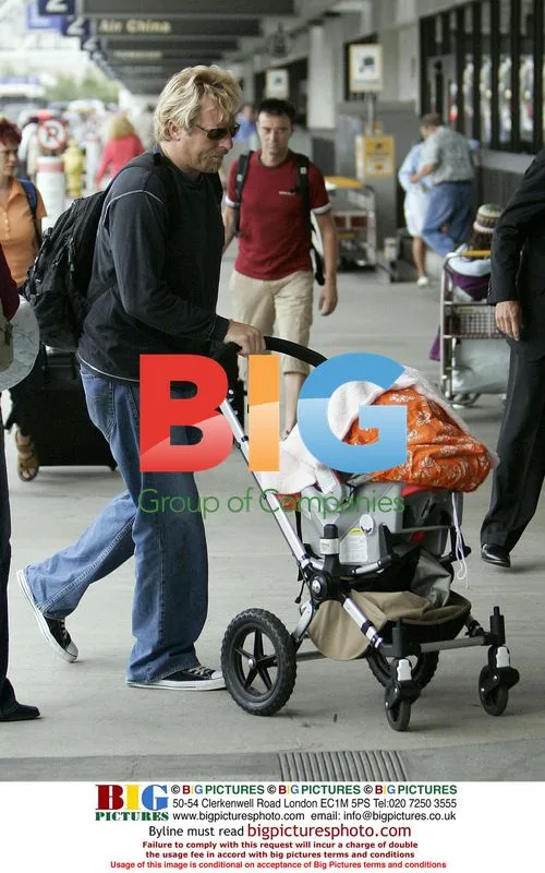 Helen Hunt & Matthew Carnahan with daughter at LAX