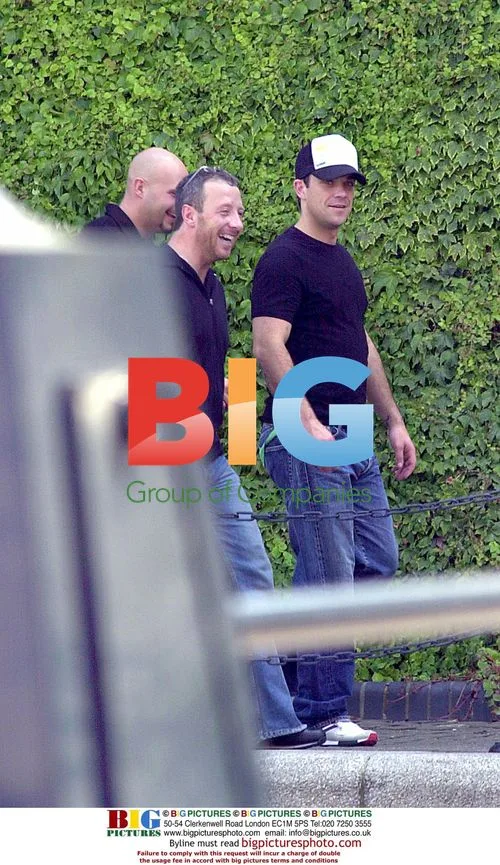 Robbie Williams Leaving London Home