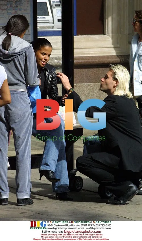 Ms Dynamite and son Shavaar shopping in London