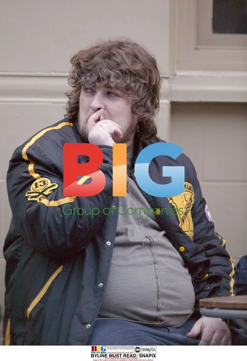 Paul Gallagher Enjoying Drink & Cigarette