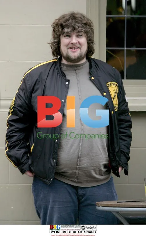 Paul Gallagher Enjoying Drink and Cigarette