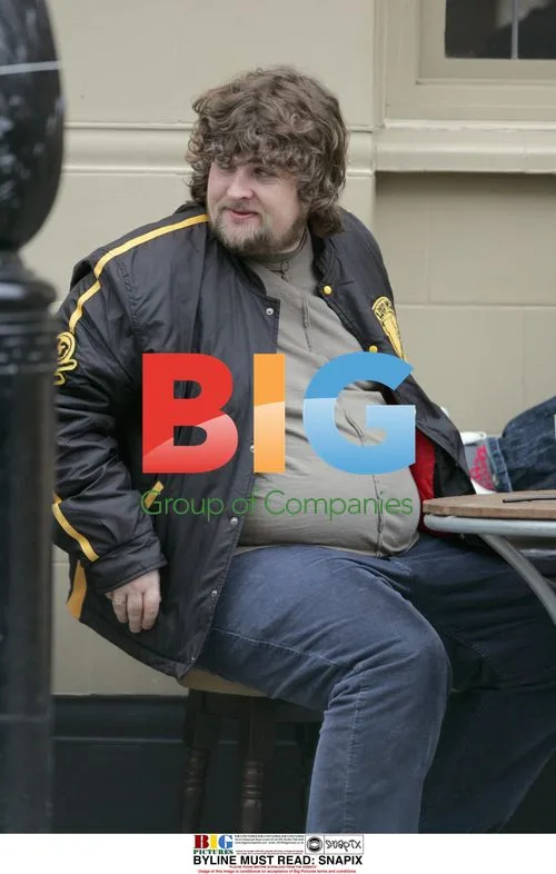 Paul Gallagher Enjoying Drink and Cigarette in London
