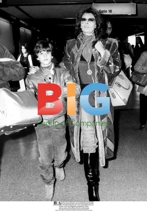 Sofia Loren Tries On Coat by Guy Laroche