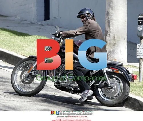 Keanu Reeves Gestures to Paparazzi