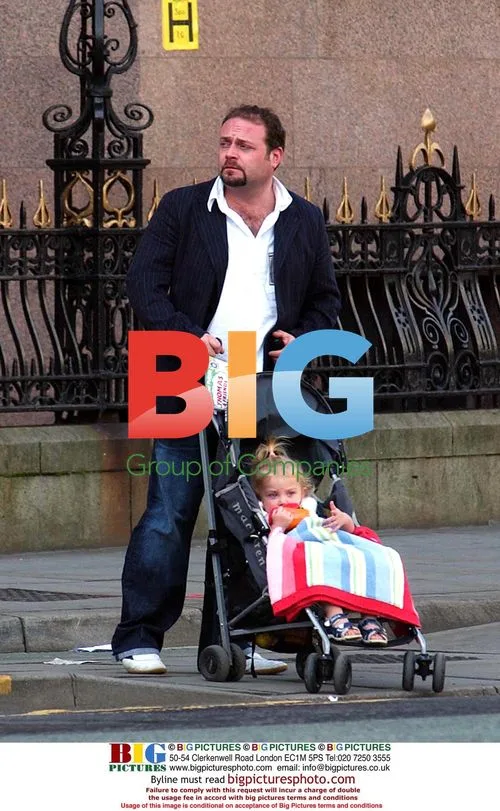 Actor John Thompson out with partner and baby