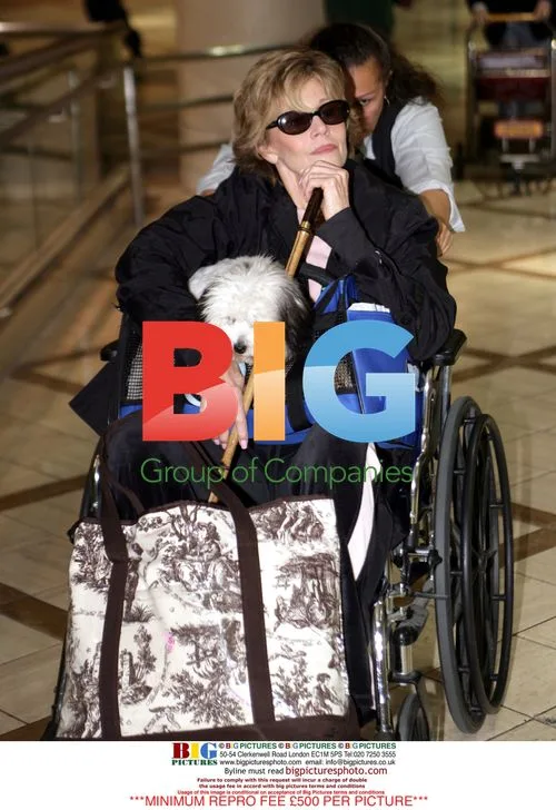 Jane Fonda wheeled into LAX