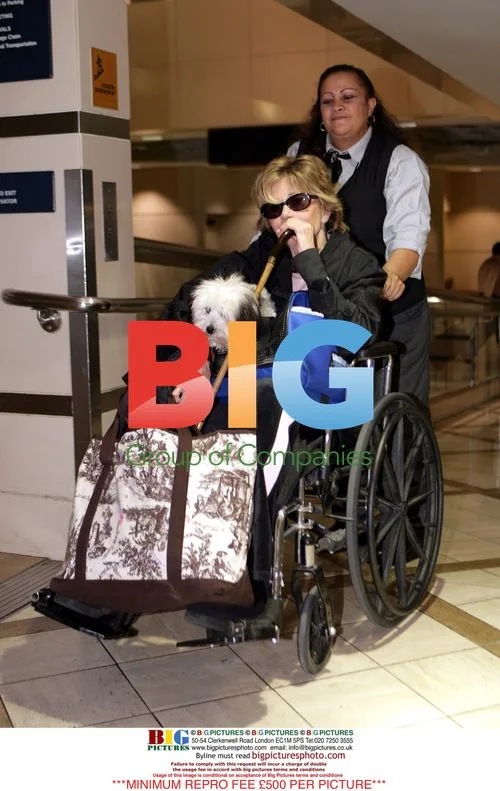 Jane Fonda Wheeled into LAX